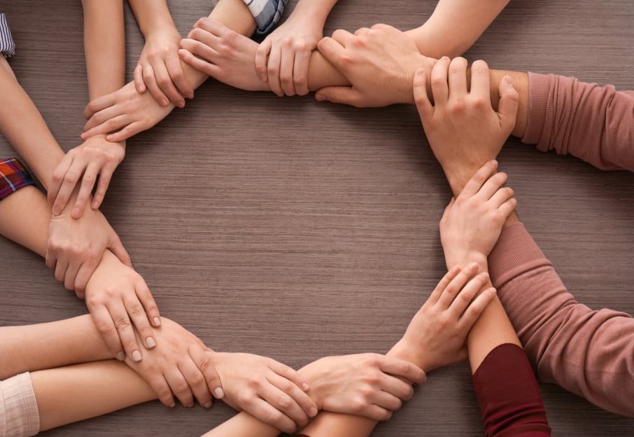 Group of People Making Circle with Their Hands